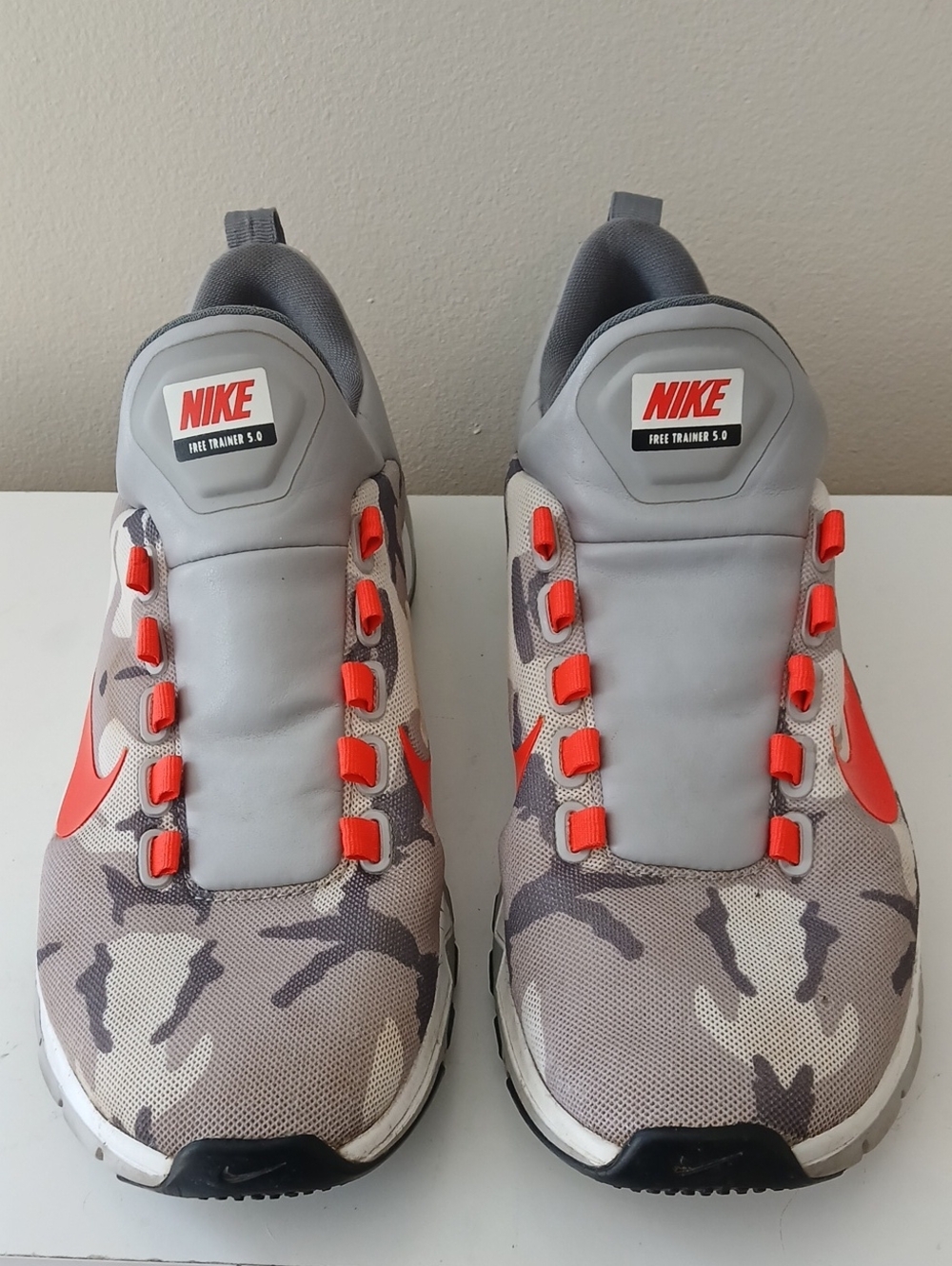 Nike Gray Camo Slip-On Sneakers with Orange Accents